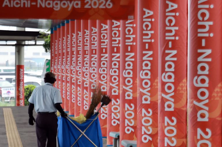 epa13230424 A worker cleans the area outside the main media center for the 20th Asian Games in Nagoya, Aichi Prefecture, central Japan, 11 September 2026, ahead of the sports event running from 19 September to 04 October. EPA/YONHAP SOUTH K